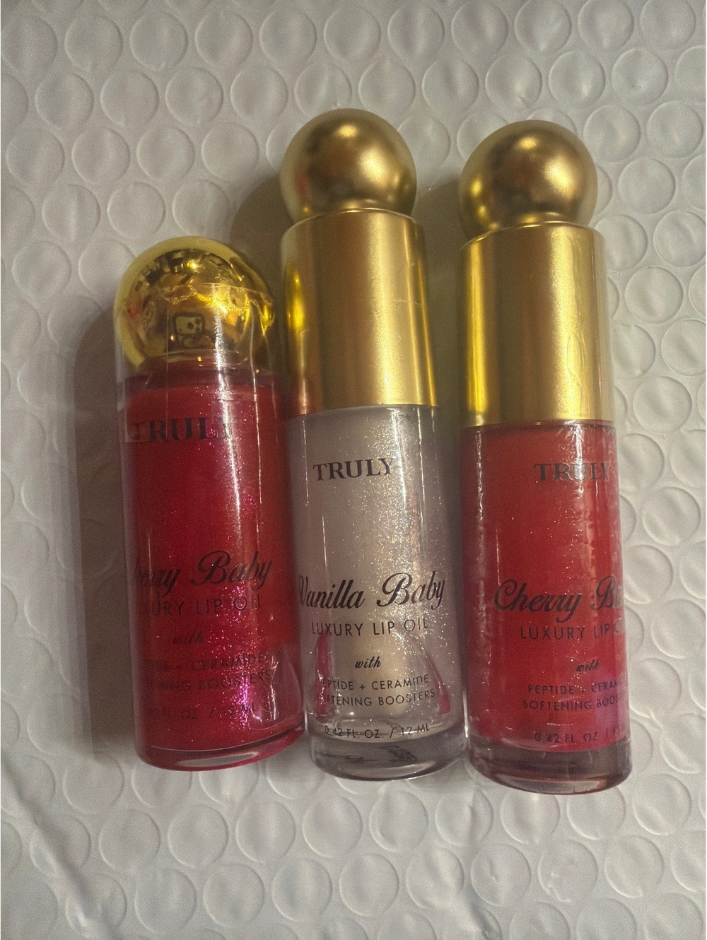 (3-pack) TRULY LUXURY LIP OIL BRAND NEW AS SEEN IN PICS!